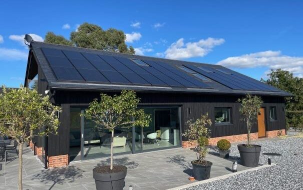 Off-grid passive house, with new solar panel installation in Norwich