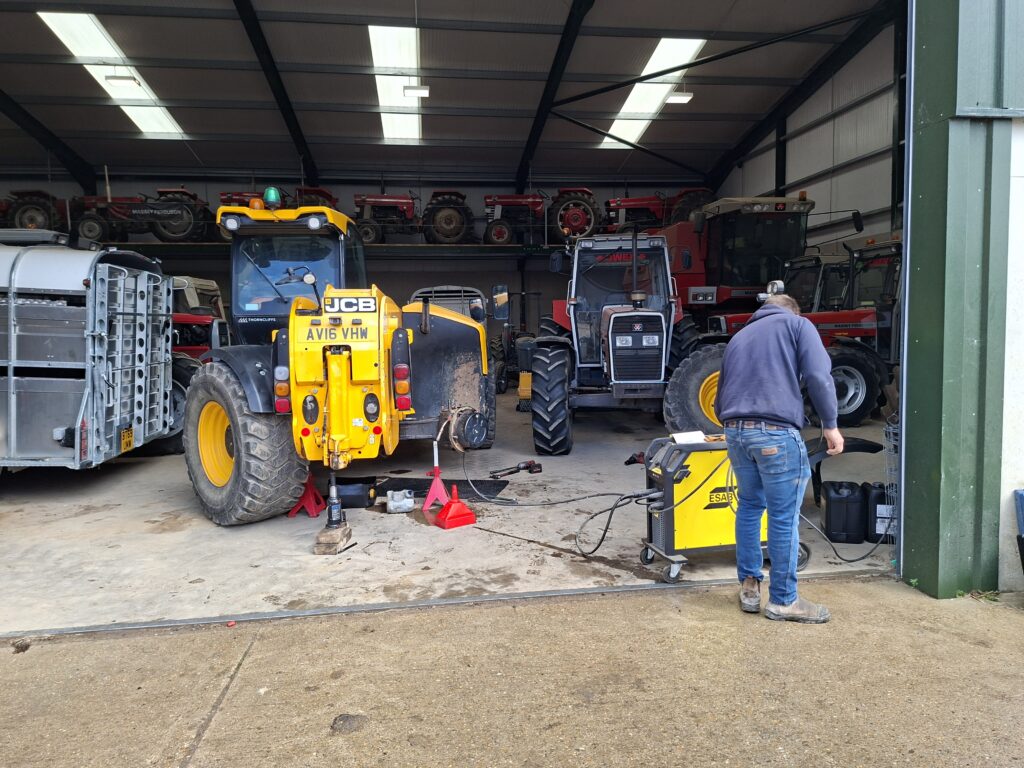 Park Hill Farm fabrication workshop — telehandler, tractors and welding plant running off the solar and battery system