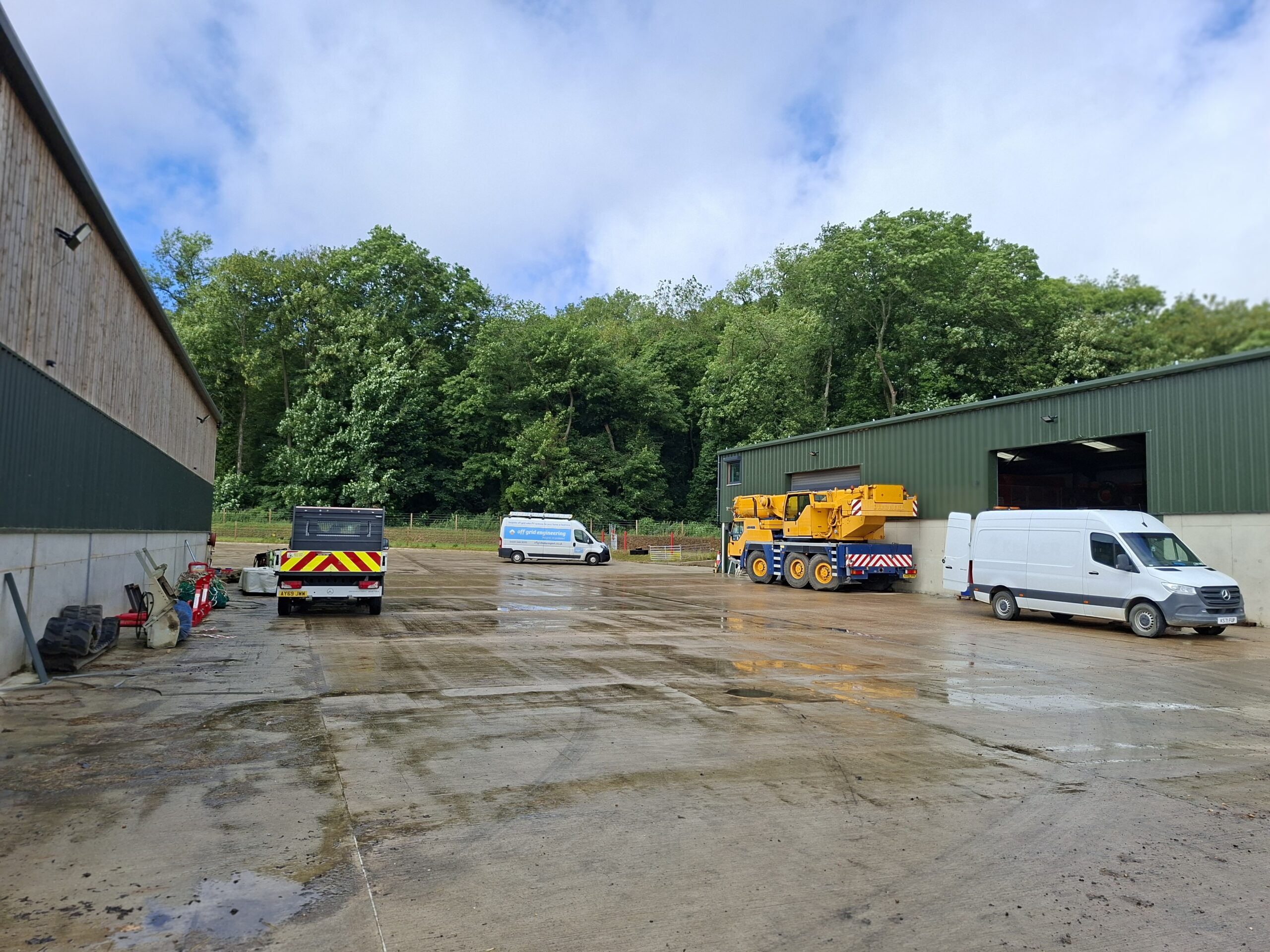 The Off Grid Engineering van on site at Park Hill Farm, alongside the yard's crane and vehicles