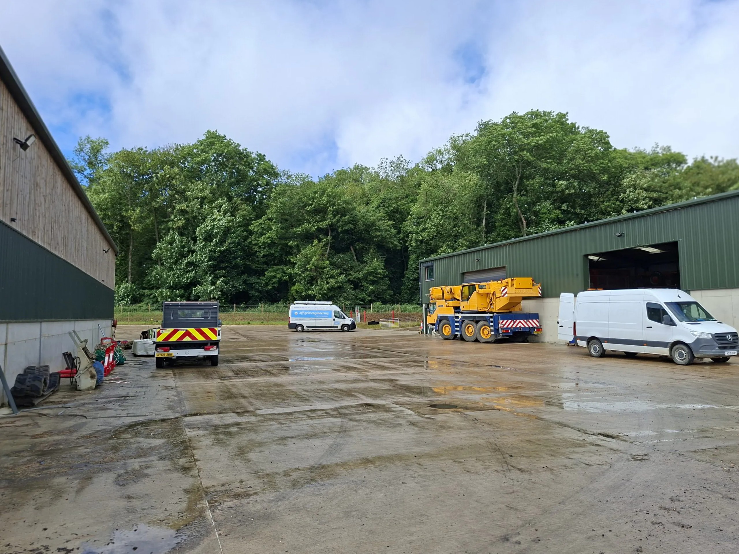 The Off Grid Engineering van on site at Park Hill Farm, alongside the yard's crane and vehicles